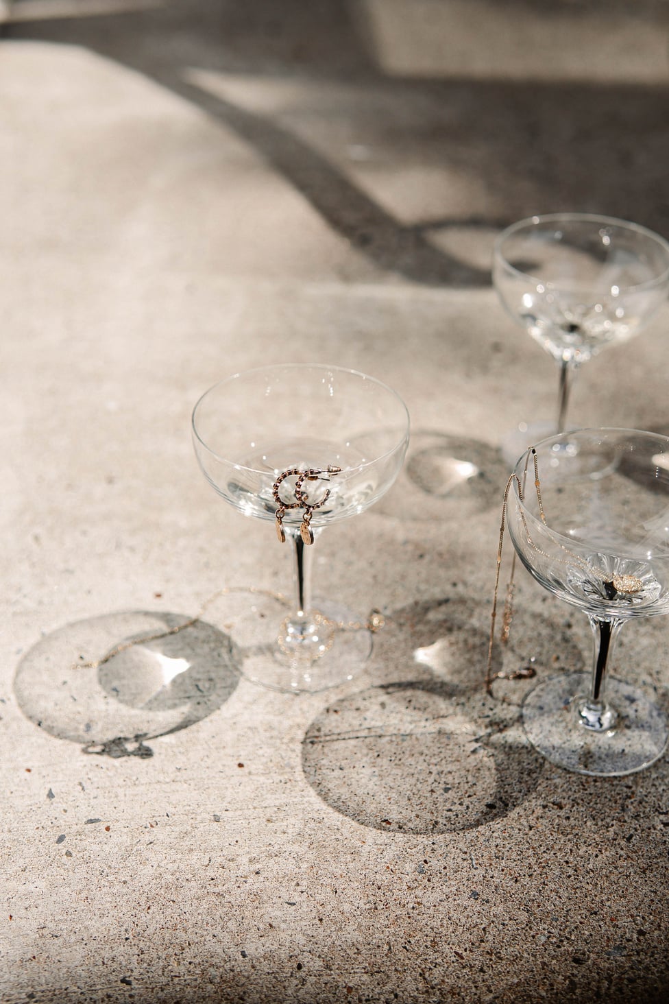 Clear Wine Glass on White Sand